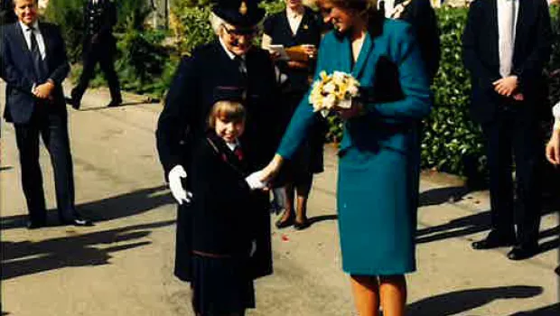 HRH Princess of Wales shakes hand with a young girl at St Piers 